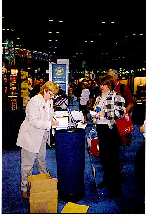 Kathy signing outside booth 1