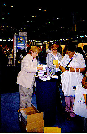 Kathy signing outside booth 2